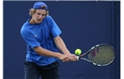 EASTBOURNE, ENGLAND - JUNE 14: Rhett Purcell of Great Britain plays a forehand against Daniel Cox of Great Britain during their Men's Singles qualifying match on day one of the Aegon International at Devonshire Park on June 14, 2014 in Eastbourne, England.  (Photo by Steve Bardens/Getty Images)